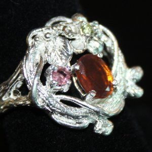 Silver ring with gemstones on beautiful setting